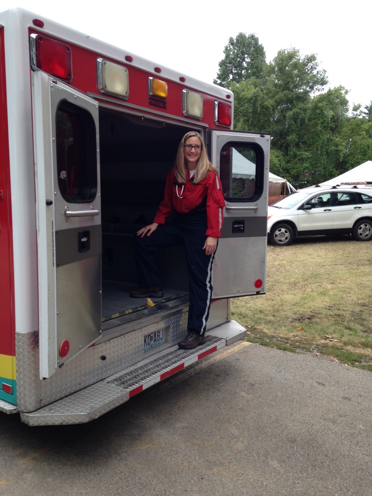 Image of Rebecca with the Cardinal Glennon Ambulance